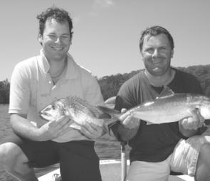 Rob and Anthony with a 35cm bream and 62cm kingfish, both caught on soft plastics within six casts of each other on a deep drop-off in Narooma's Wagonga Inlet. 